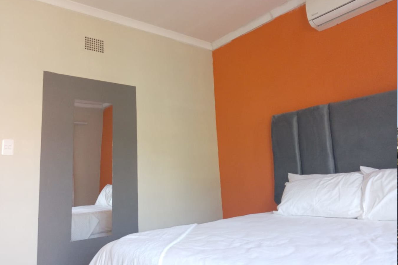 Deluxe Room at Elite Stay Guest House Rustenburg - queen bed with shower